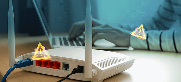A laptop and router with security warning symbols